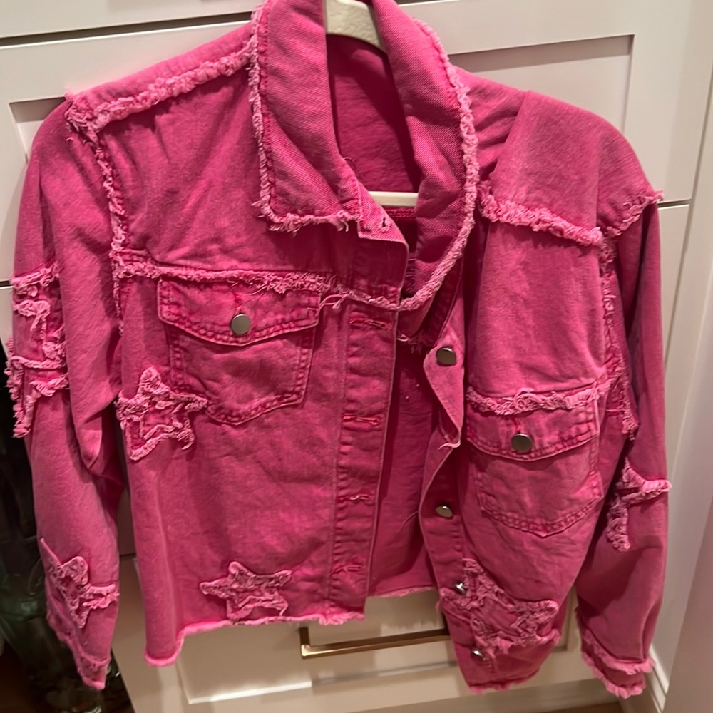 Super cute pink jean jacket with stars. Never worn